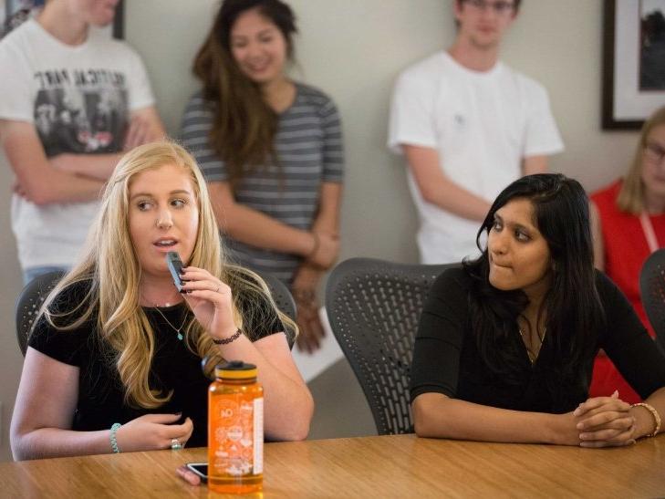 a student speaks during a student senate session